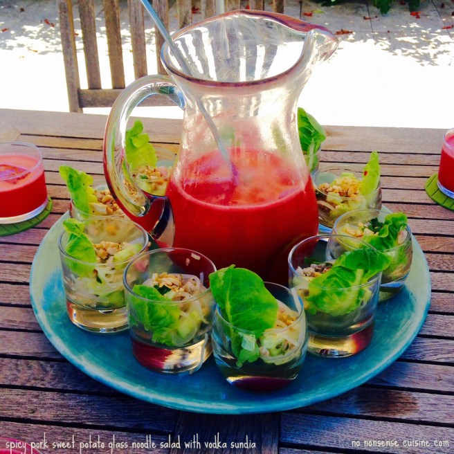 spicy pork sweet potato glass noodle salad with vodka sundia. with text